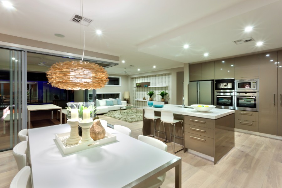 Well-lit modern kitchen and dining area.