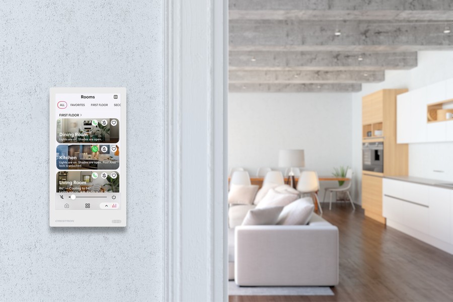A living area with a smart home platform on the wall.